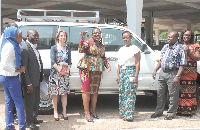  Nana Oye-Lithur (4th right) displaying the keys to the new Toyota Land cruiser after the presentation. Looking on are Madam Susan Ngongi (3rd right) and some officials from the ministry and UNICEF. Picture: EDNA ADU-SERWAA